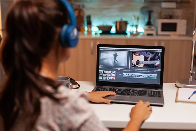 Woman editing video in laptop